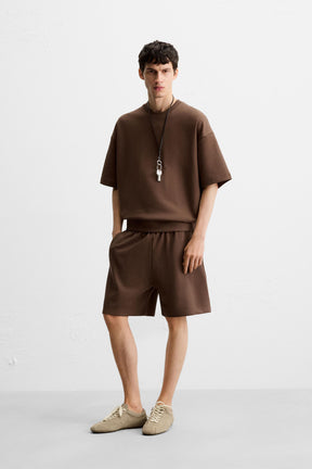 TECHNICAL INTERLOCK BERMUDA SHORTS - Image 1