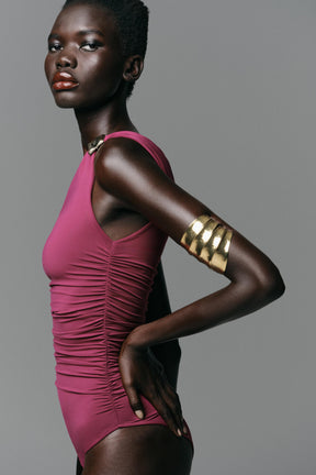 Asymmetric metal appliqué bodysuit