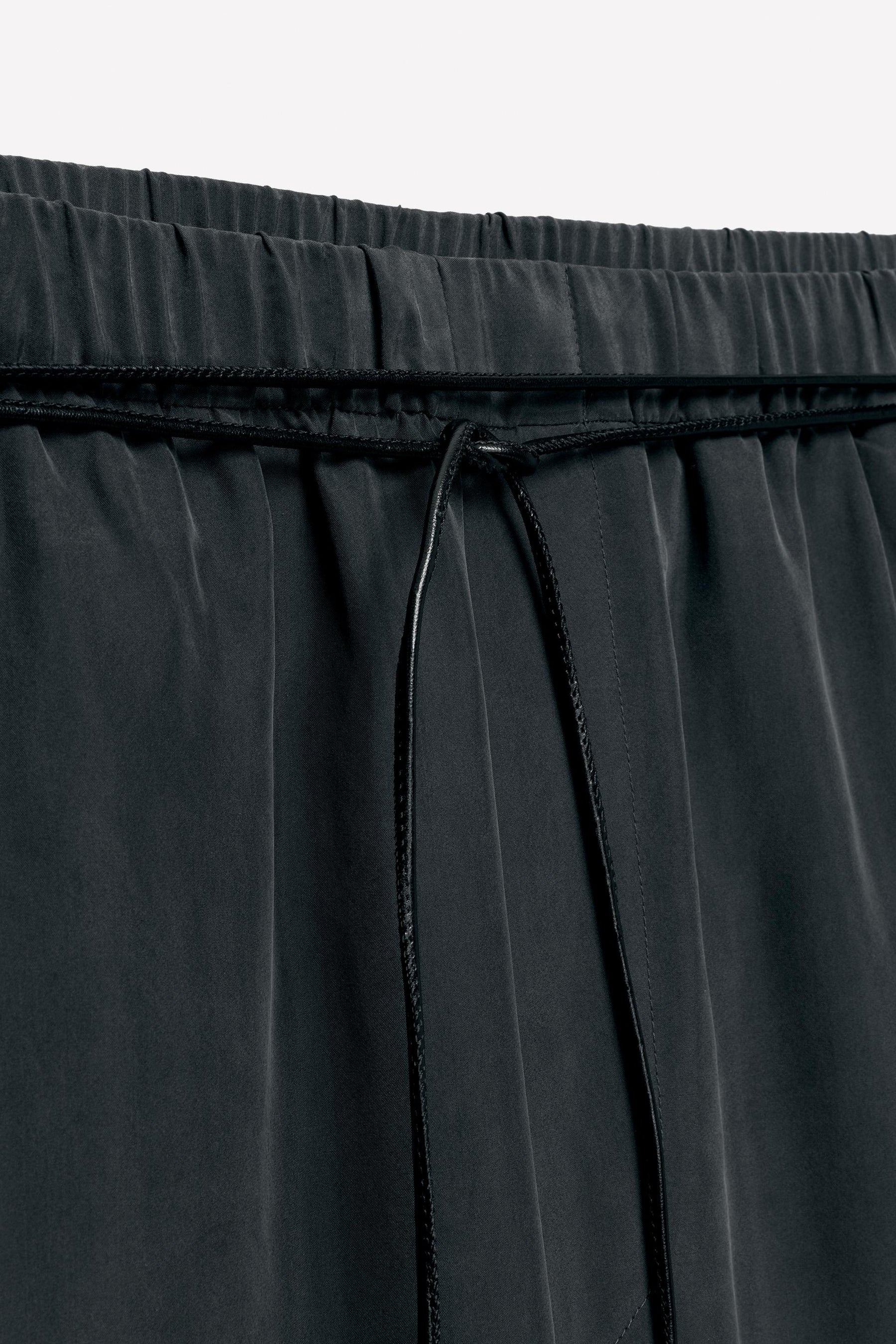 Silk trousers with belt.