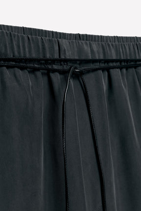 Silk trousers with belt.