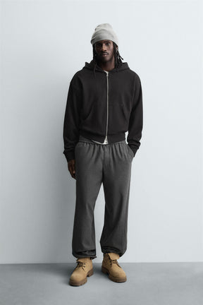 TEXTURED RELAXED FIT TROUSERS - Image 1