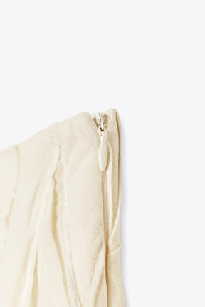 ASYMMETRIC PLEATED SKIRT