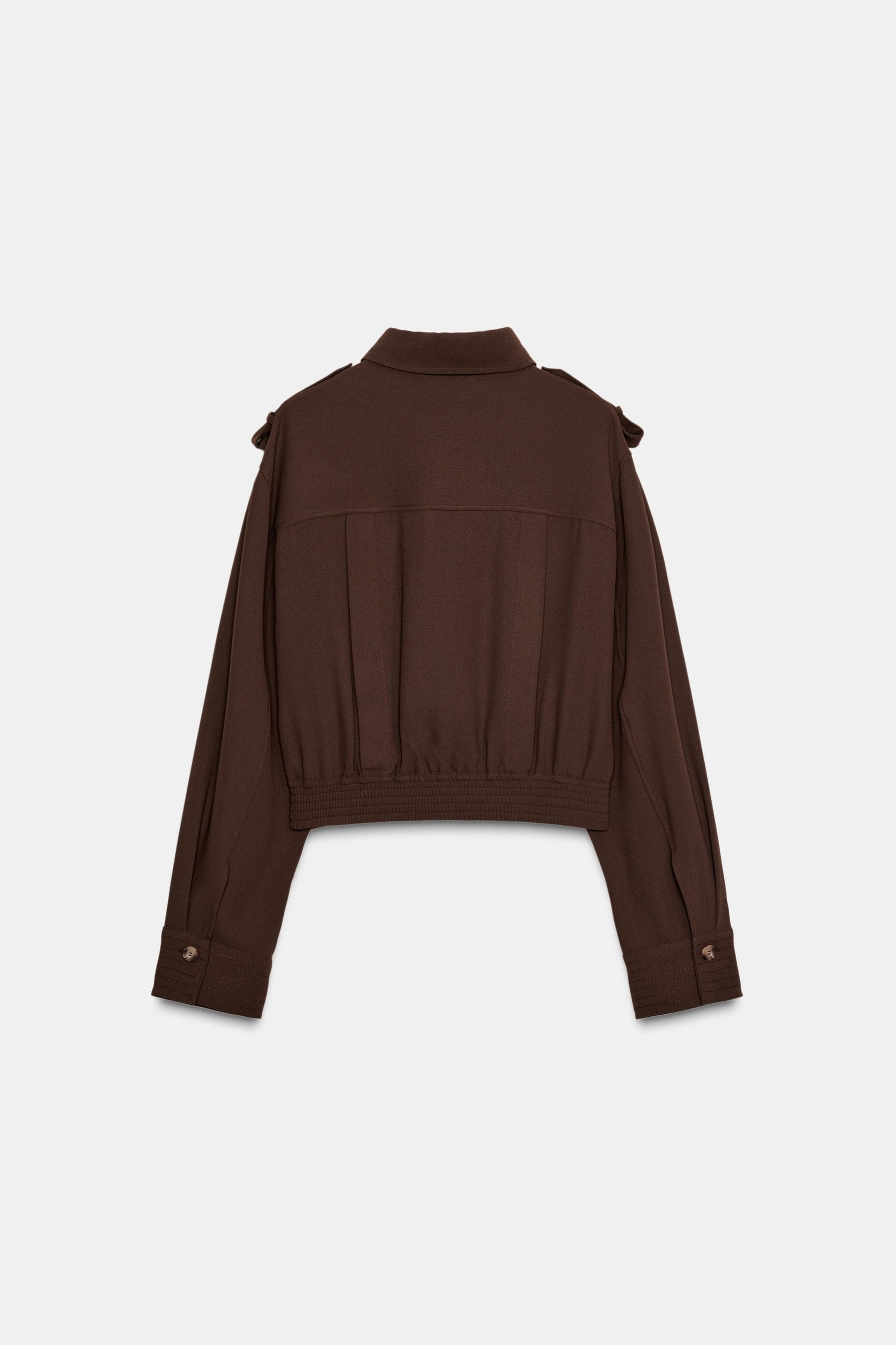 Shirt with shoulder tabs